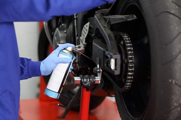 Close up of a motorcycle mechanic hands