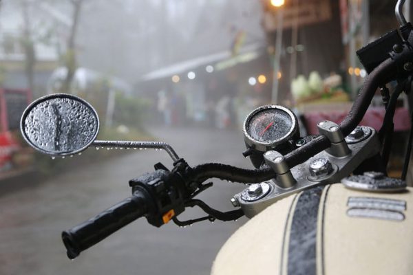 vintage motorcycle sitting in the rain