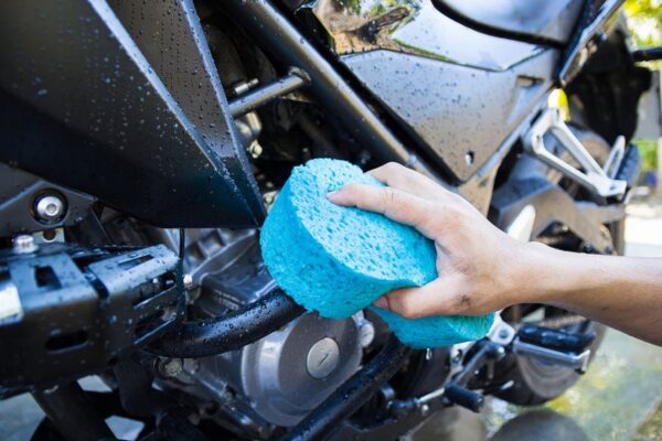 washing black motorcycle